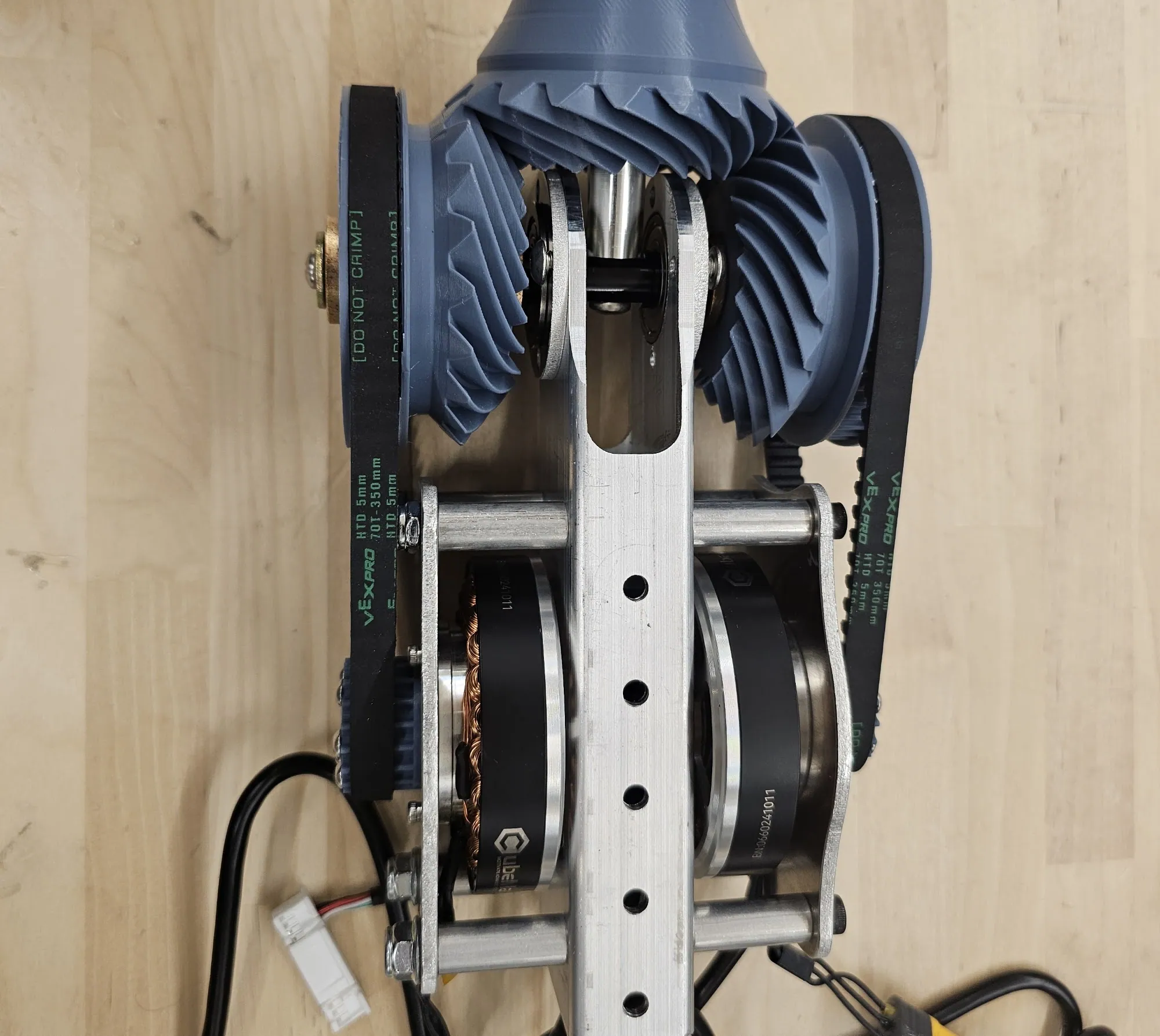 Top down: hypoid gears, HTD belts, CubeMars motors on the T-shaft