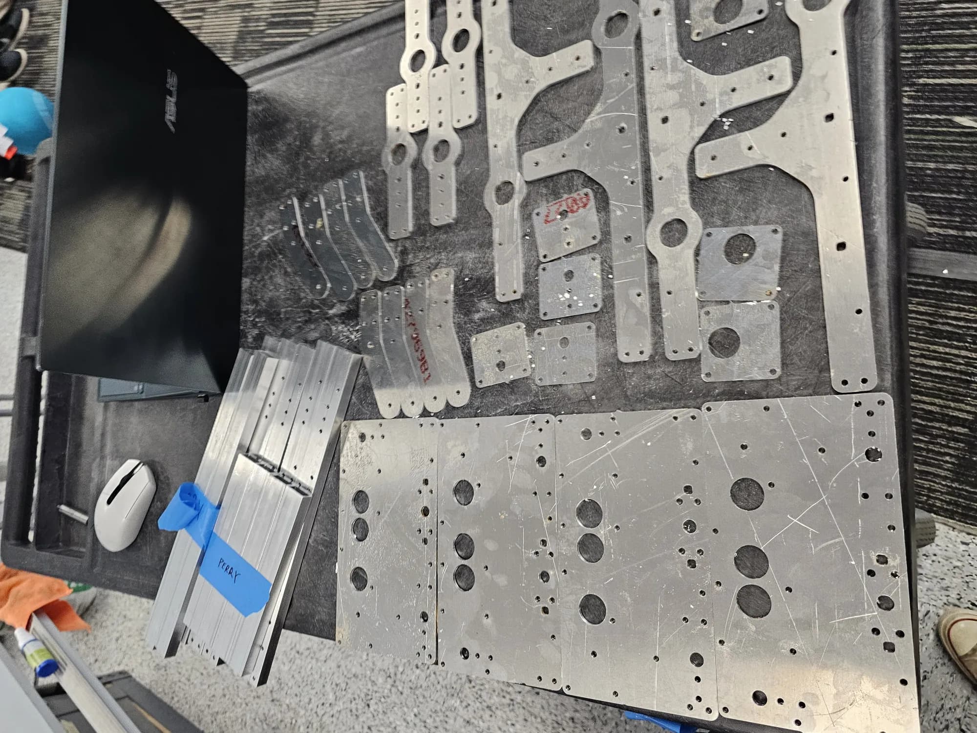 Parts off the machines, laid out for deburring