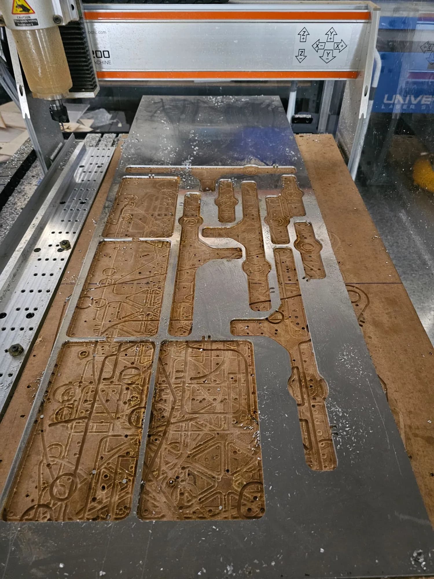 CNC router cutting a plate nest